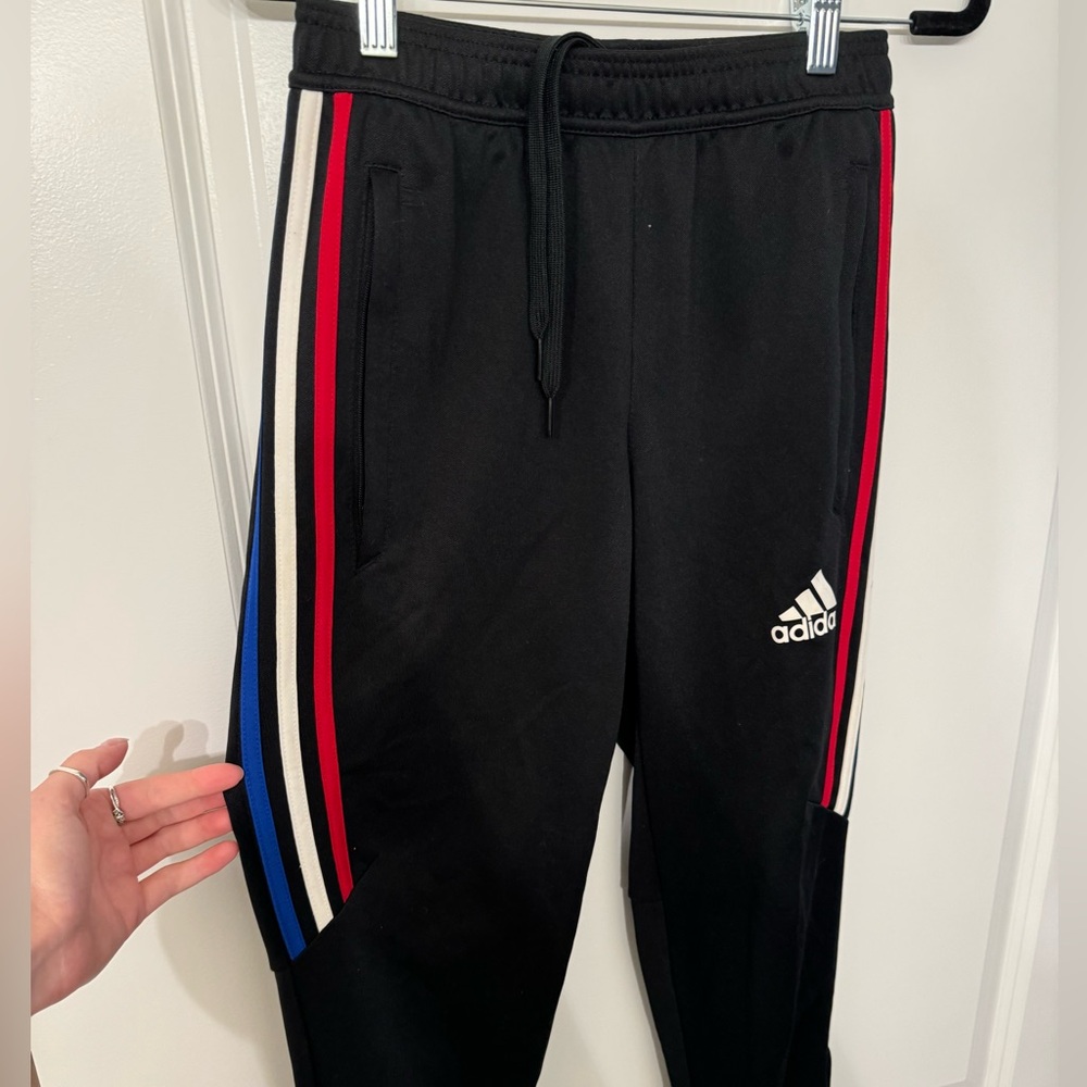 Adidas track pants with red white and blue stripe